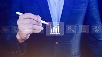 Big data analytics and business intelligence BI concept with chart and graph icons on digital screen interface and business people in the background. photo