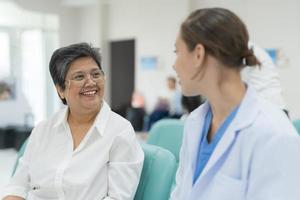 Elderly woman checkup Discuss the symptoms. photo