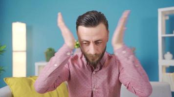 Stressed man is worried and can't think confused. Man rubbing his face from stress, worried and confused. video