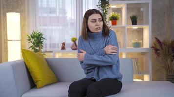 Characterized by extreme anxiety and fear, young woman panics at home alone. Young woman with schizophrenia and paranoia is alone at home and acting strangely, going crazy and losing her mind. video