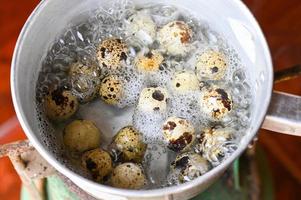 quail eggs , boiled eggs food in a hot pot on the stove, egg cooking healthy eating concept, eggs menu food photo
