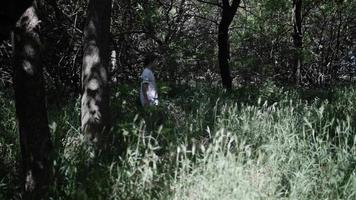 Young Man, Teen Boy, Hiking, Walking, In Woods In Slow Motion video