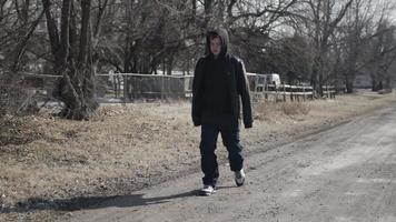 Young Man, Teenager Walking In Slow Motion On Road video