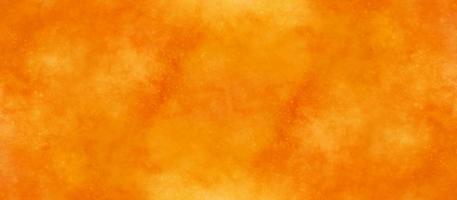 orange and yellow background, abstract watercolor background with space. colorful sunrise or sunset colors in cloudy shapes. beautiful hues of yellow in hand painted watercolor background. photo
