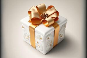 White gift box with golden bow. photo