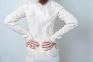 woman having back pain. Urinary system and Stones, Cancer, world kidney day, Chronic kidney stomach, liver pain and pancreas concept photo