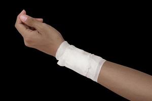 gauze bandage patient with hand wrap injury isolated on black background and clipping path photo