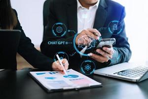 Man and woman using chatbot in computer and tablet  smart intelligence Ai.Chat GPT Chat with AI Artificial Intelligence, developed by OpenAI generate. Futuristic technology, robot in online system. photo