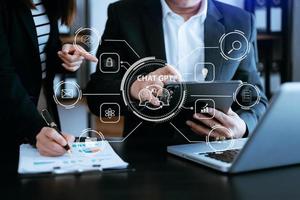 Man and woman using chatbot in computer and tablet  smart intelligence Ai.Chat GPT Chat with AI Artificial Intelligence, developed by OpenAI generate. Futuristic technology, robot in online system. photo