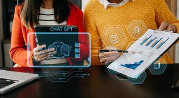 Man using chatbot in computer and tablet  smart intelligence Ai.Chat GPT Chat with AI Artificial Intelligence, developed by OpenAI generate. Futuristic technology, robot in online system. photo