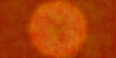 Circular shape, abstract Sun drawing, Orange, red and yellow circle with uneven edges. Watercolor sun isolated on dark background. Grunge colorful painting background with space for text. photo