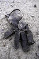 Dirty glove thrown away photo