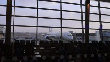 Abu Dhabi Airport terminal with passengers and plane video