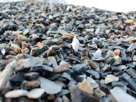 Stack of broken stones.Big pile of broken Rocks and Boulders.Pile stack of huge natural granite stone.Stack of Crushed Stones in quarry. Colorful pebble. photo