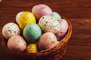 Pastel Easter eggs background. Spring greating card. Easter eggs in basket photo