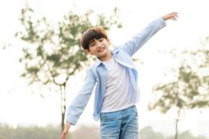 Asian boy portrait in the park photo