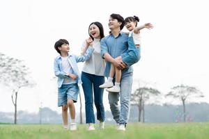 Asian family photo walking together in the park