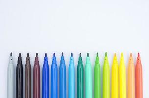 colorful markers isolated on white background photo