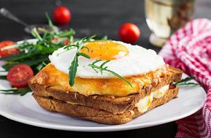 Breakfast. French cuisine. Croque madame sandwich close up on the table. photo