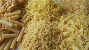 Layout of Italian raw pasta, different types and shapes of pasta photo