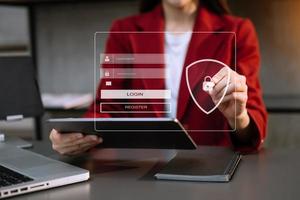 Cyber security concept, Login, User, identification information security and encryption, secure access to user's personal information woman using smart phone and tablet in office photo