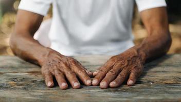 Male wrinkled hands, old man is wearing photo