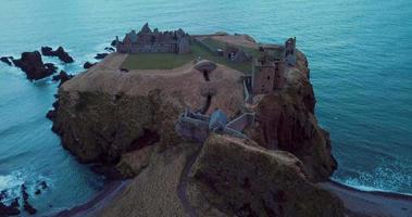 Aerial view of the ruins ancient Donator Castle in Scotland video
