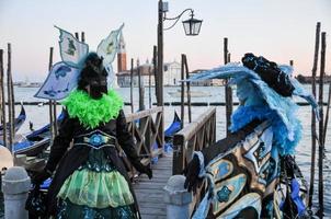 Unidentified people wearing carnival masks at the Venice Carnival in Venice, Italy, circa February 2022 photo