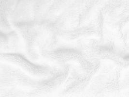 White clean wool texture background. light natural sheep wool. white seamless cotton. texture of fluffy fur for designers. close-up fragment white wool carpet. photo