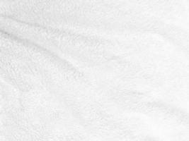 White clean wool texture background. light natural sheep wool. white seamless cotton. texture of fluffy fur for designers. close-up fragment white wool carpet. photo