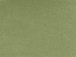 verde matcha olor terciopelo tela textura usado como antecedentes. vacío verde tela antecedentes de suave y suave textil material. allí es espacio para texto. foto