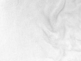 White clean wool texture background. light natural sheep wool. white seamless cotton. texture of fluffy fur for designers. close-up fragment white wool carpet. photo