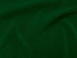 Dark green old velvet fabric texture used as background. Empty green fabric background of soft and smooth textile material. There is space for text. photo