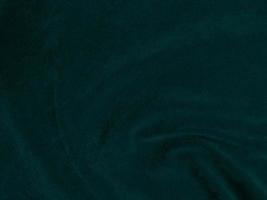Dark green old velvet fabric texture used as background. Empty green fabric background of soft and smooth textile material. There is space for text. photo