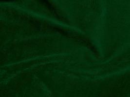 Dark green old velvet fabric texture used as background. Empty green fabric background of soft and smooth textile material. There is space for text. photo