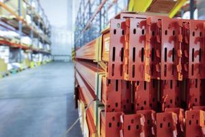 Warehouse premises of a factory or workshop with metal shelves. photo