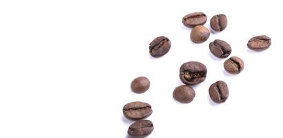 Scattered coffee beans on a white background. Arabica or robusta. photo