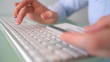 Woman office worker typing on the keyboard video