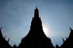 Silhouette of Ancient White Pagoda at Wat Arun Temple, Bangkok Thailand. photo