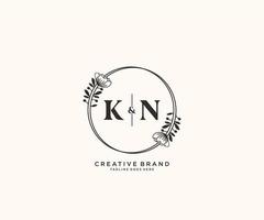 initial KN letters hand drawn feminine and floral botanical logo suitable for spa salon skin hair beauty boutique and cosmetic company. vector