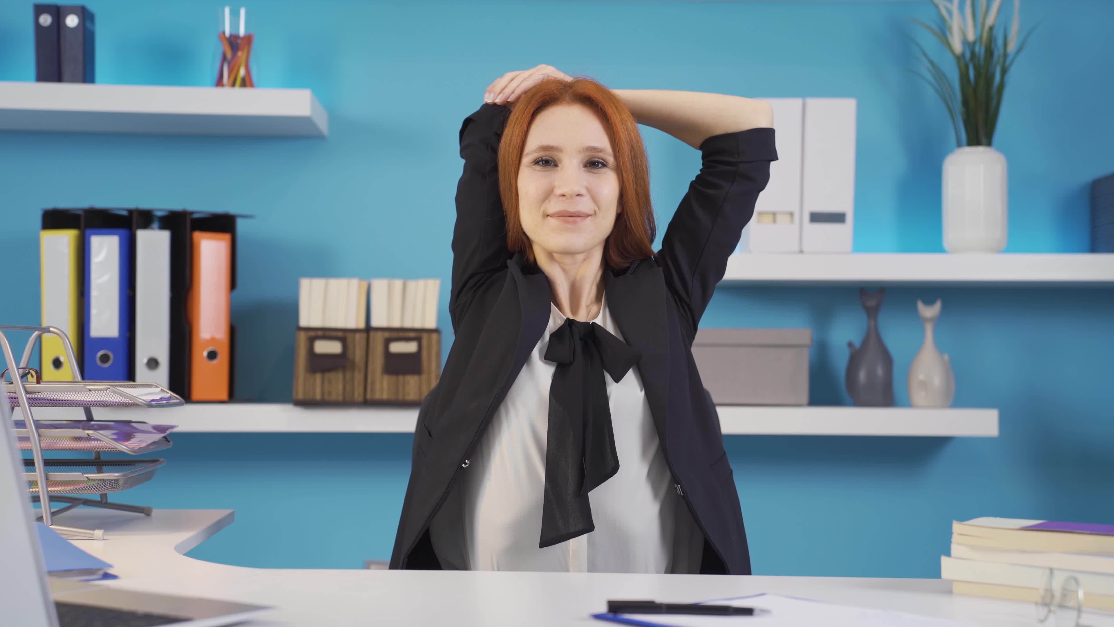 Exercises that can be done in the office. Stretching and arm exercises. Business woman
