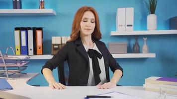 Exercises that can be done in the office. Waist exercises. Business woman doing lower back exercises in the office. video