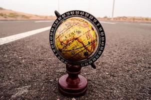 Globe on the road photo