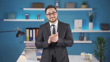 Happy businessman clapping looking at camera. Happy businessman clapping looking at camera. Businessman clapping looking at camera. video