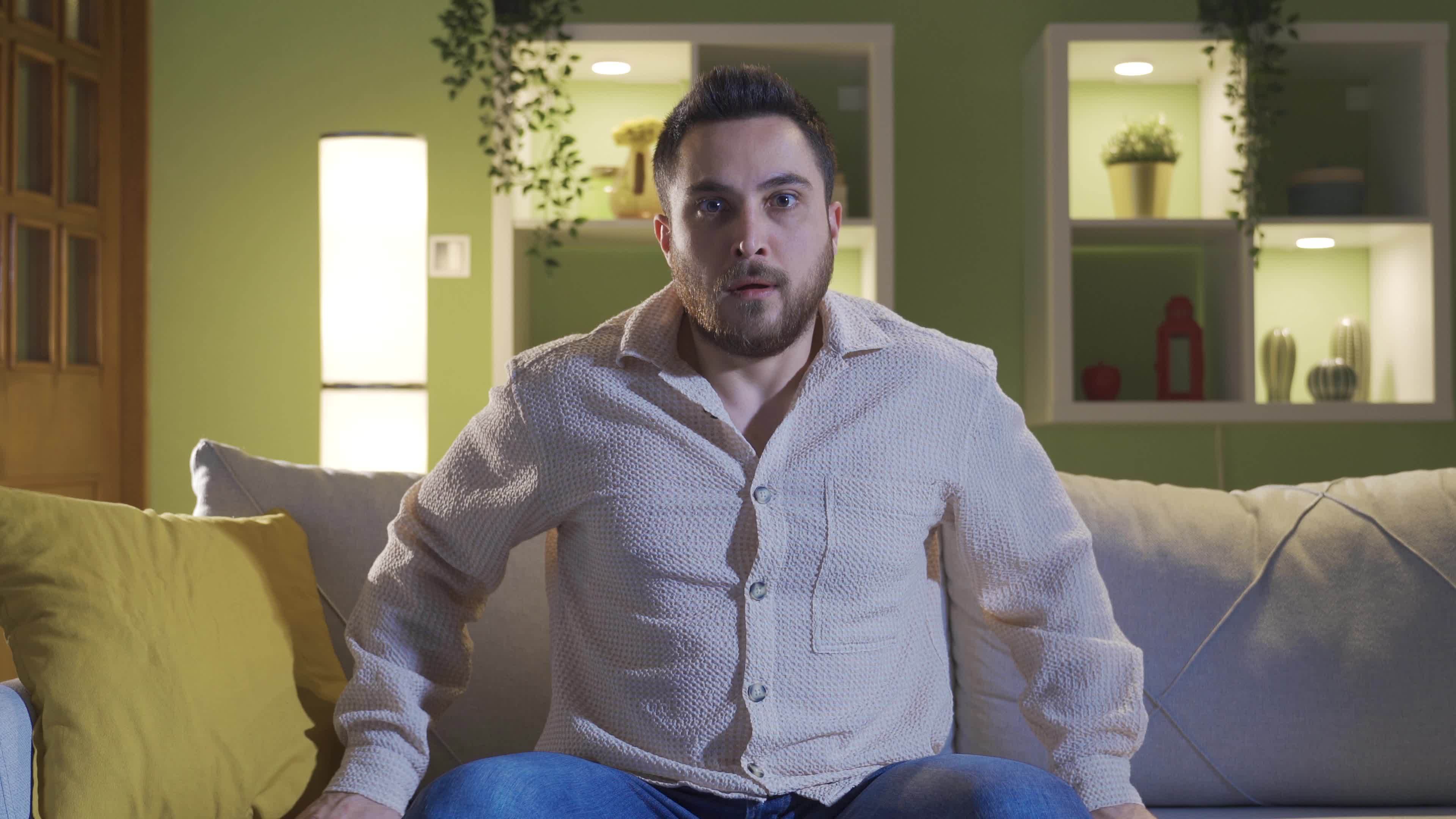 The schizophrenic sitting alone at home is afraid of hallucinations