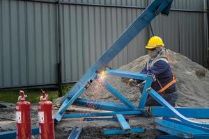 Metal cutter, steel cutting with acetylene torch ,worker to cutting steel in construction site,Selective focus on tool photo