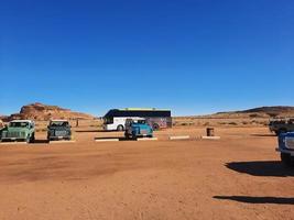 Al Ula, Saudi Arabia, March 2023 - Jeeps are parked at different places in the desert to take tourists to different places during the day in Al Ula, Saudi Arabia. photo