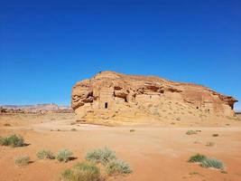 Beautiful daytime view of Al Hegra, Madain Saleh archaeological site in Al Ula, Saudi Arabia. photo