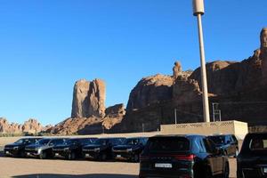 Al Ula, Saudi Arabia, March 2023 - Jeeps are parked at different places in the desert to take tourists to different places during the day in Al Ula, Saudi Arabia. photo