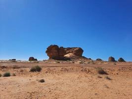 Beautiful daytime view of Al Hegra, Madain Saleh archaeological site in Al Ula, Saudi Arabia. photo